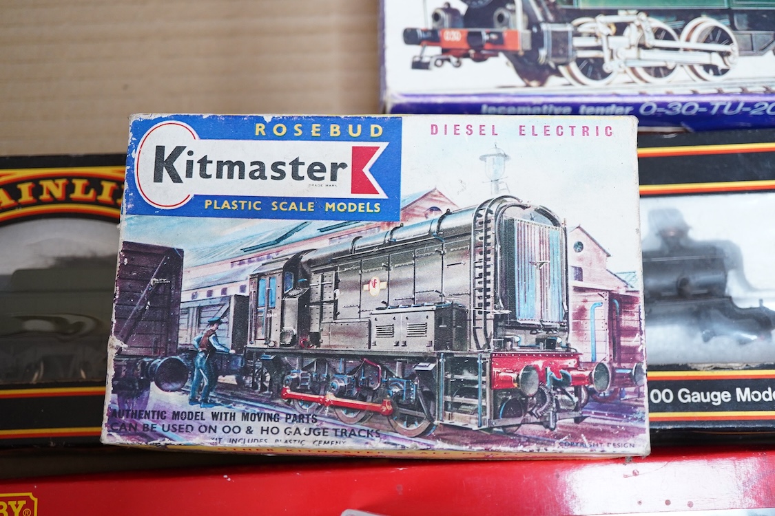 A quantity of 00 gauge railway by various makes, comprising; nine locomotives by Tri-ang, Hornby Dublo, etc. (one missing tender), sixteen maroon bogie coaches and eighteen freight wagons